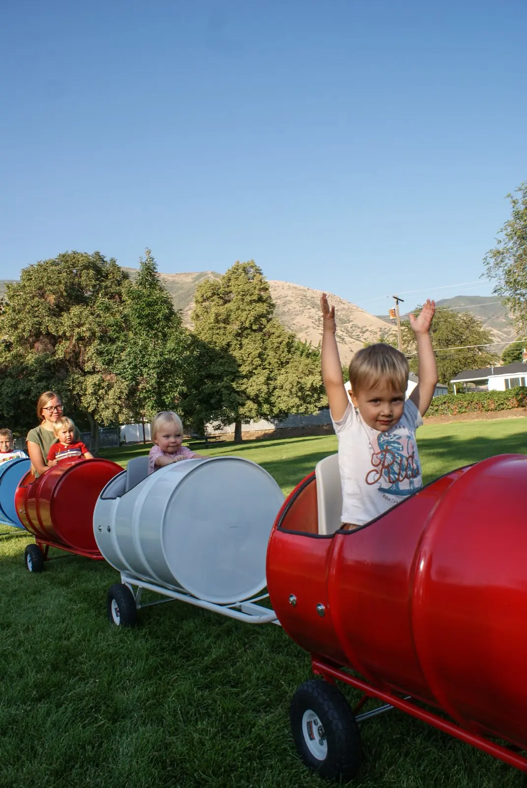 A child cheering in the barrel train